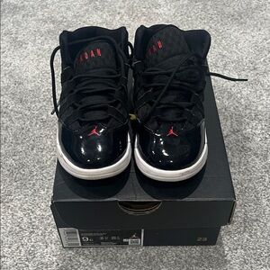 Jordan’s Nike Kids Black and Red Sneakers